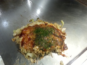 Okonomiyaki! It was pretty good, and apparently it's a specialty of Hiroshima and Osaka.
